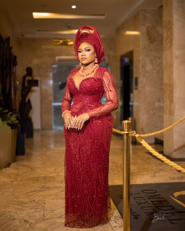 African Corset Gown Red Lace Features Sweetheart Neckline With Draping And Pencil Sleeves. (1)
